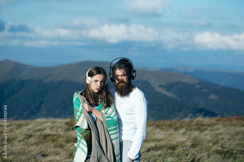 Young couple with headphones Young couple with headphones