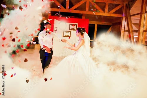 Wedding dance in restaurant with varioius lights and smoke photo