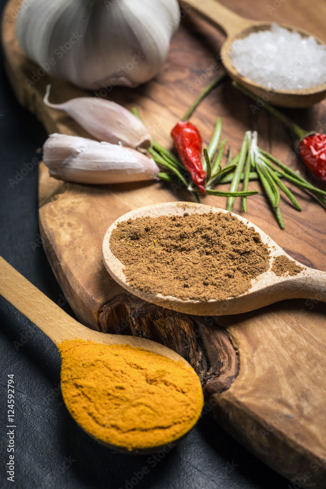 Spices on rustic wooden table. Overhead view food photography.