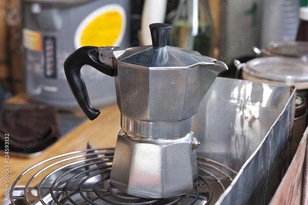 Classic Italian coffee pot boiling on stove Classic Italian coffee pot boiling on stove