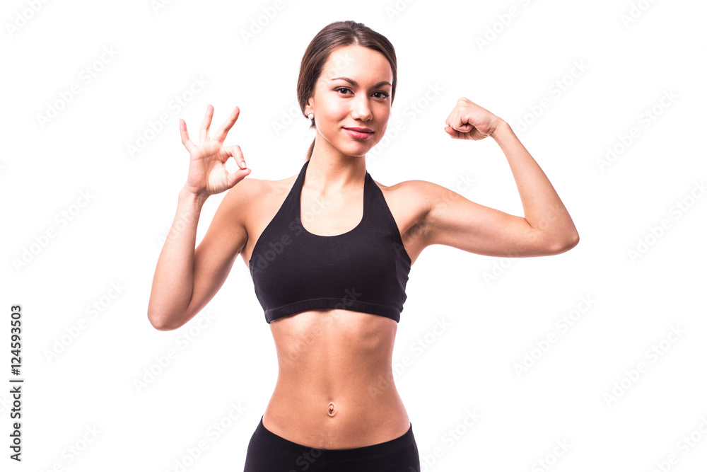 Sport girl demonstrate power with ok gesture Sport girl demonstrate power with ok gesture