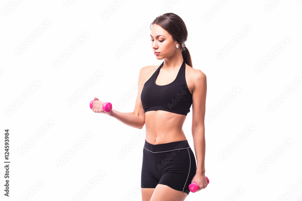 Young woman is exercising with dumbbells Young woman is exercising with dumbbells