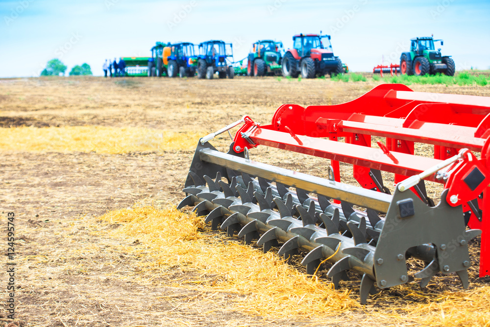 Obraz premium Agricultural cultivator close-up on the ground