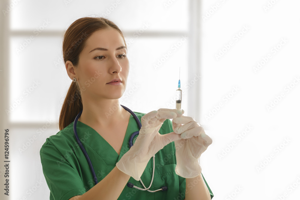Medical doctor with syringe. Young female nurse with syringe Medical doctor with syringe. Young female nurse with syringe