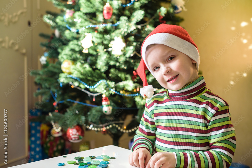 Kid child boy making by hands x-mas decorations Kid child boy making by hands x-mas decorations