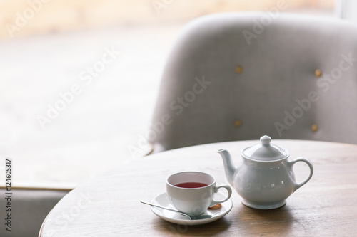 Obraz na płótnie Still life details, cup of tea on a coffee table in living room w salonie