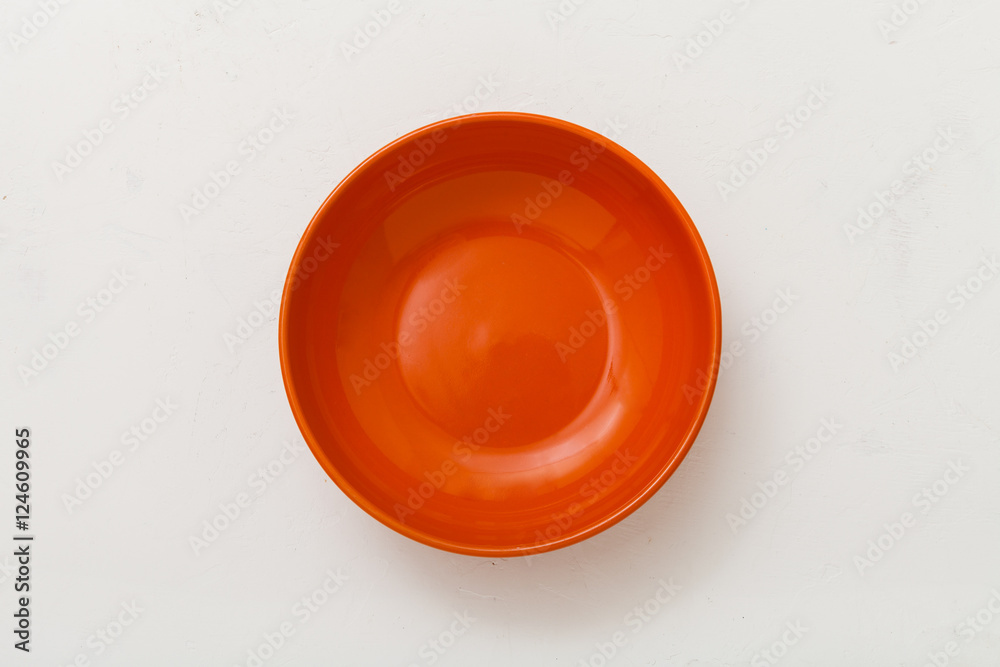 top view of orange bowl on plastering plate