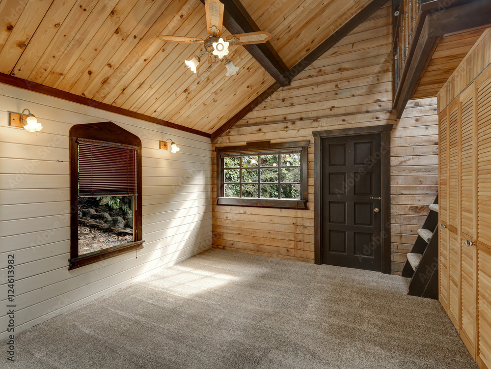 Hallway interior in large wooden cabin.