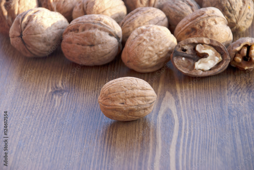 walnuts on the wooden-table. walnuts on the wooden-table.