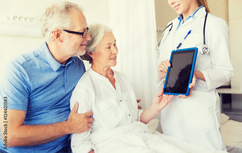 senior woman and doctor with tablet pc at hospital