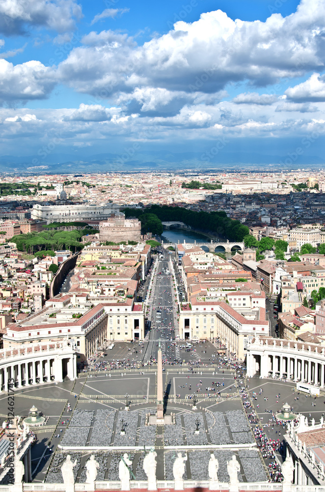 A view of Rome from the bell tower of the St. Peter's Basilica . Under cloudy skies the city spread, visible Castel Sant'Angelo and Piazza San Pietro.