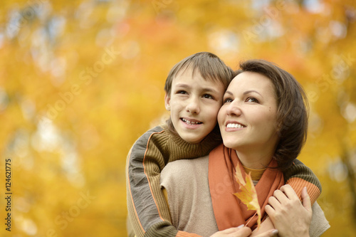 Mother with boy in autumn park