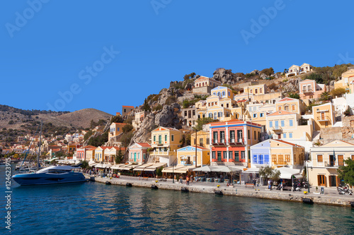 Symi island - Colorful houses and small boats at the heart of the village © STOCKSTUDIO