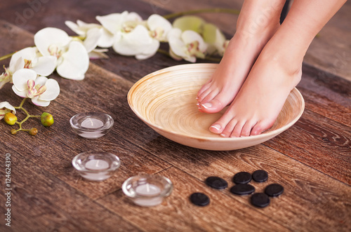 Spa composition of legs and flowers