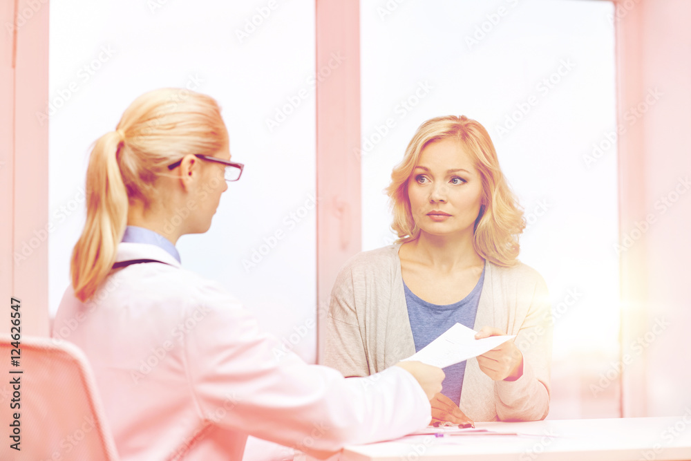 doctor giving prescription to woman at hospital doctor giving prescription to woman at hospital