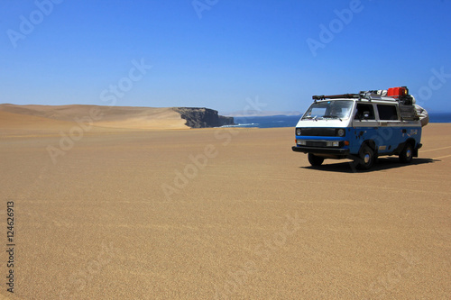Van at paracas ocean front in the sand dunes