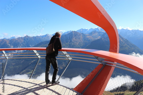 On a viewpoint on the Stubnerkogel, Gastein mountains, Austria, Europe. There is a great view of a mountain range of the Hohe Tauern. photo