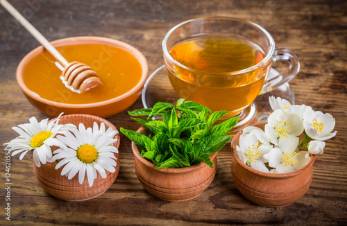 Herbal tea with mint, chamomile, jasmine flowers and honey
