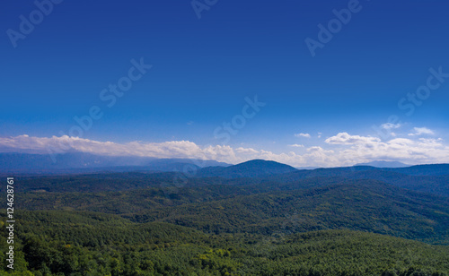 Aerial landscape. Hills covered with forest.