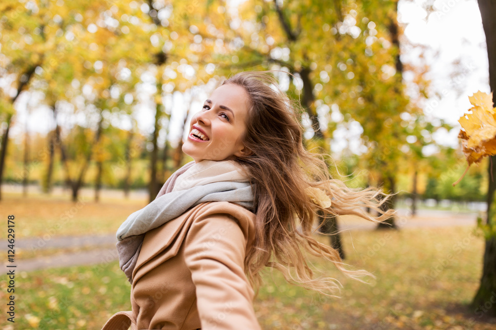 beautiful happy young woman walking in autumn park beautiful happy young woman walking in autumn park