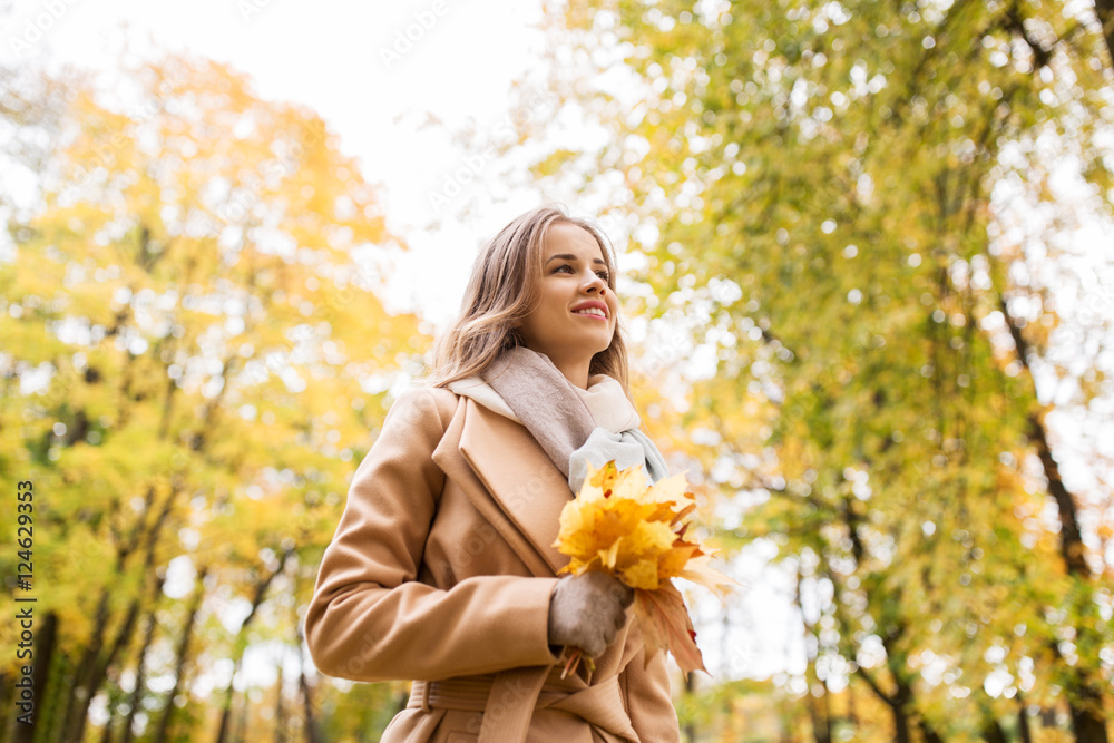 beautiful woman with maple leaves in autumn park beautiful woman with maple leaves in autumn park