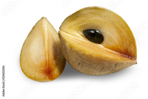 sapodilla plums with cut isolated on white. Manilkara zapota. photo