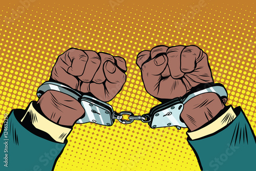 Hands up African American in handcuffs