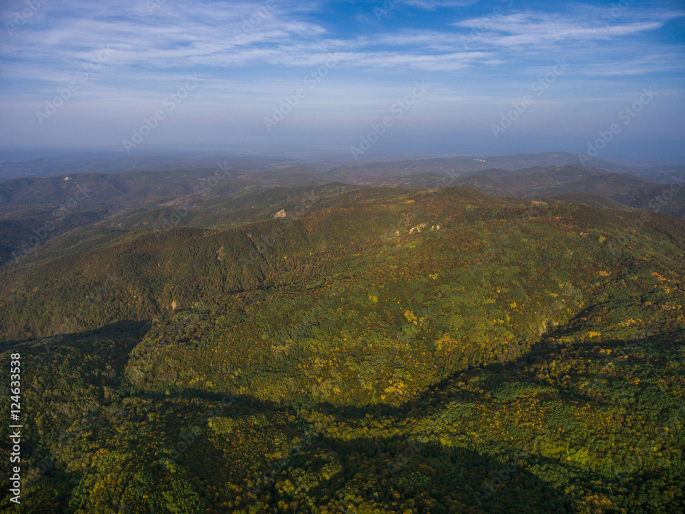 Landscape of mountain valley with autumn forest.