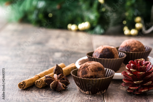 Christmas chocolate truffles on wooden table    