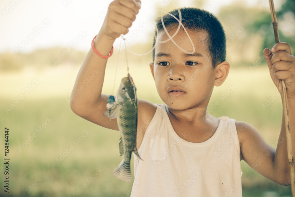 Little Boy Catching a Fish. Kids Fishing. Stock Photo