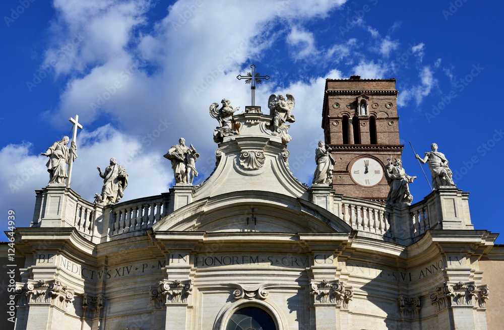Santa Croce in Gerusalemme Basilica in Rome, with statues of saints and clouds Santa Croce in Gerusalemme Basilica in Rome, with statues of saints and clouds