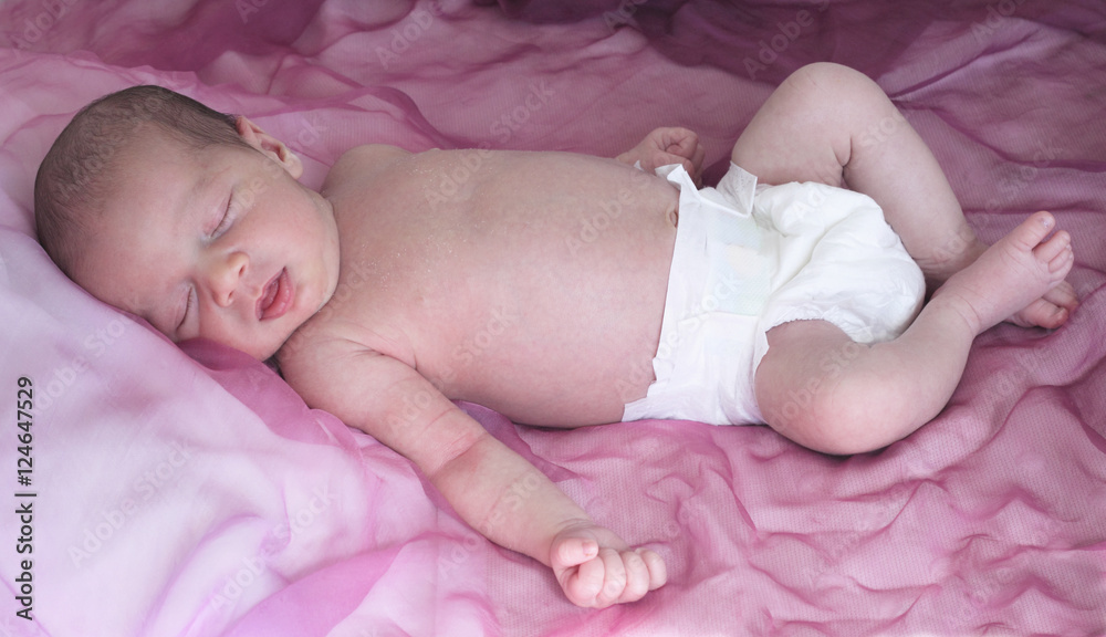 newborn sleeping in a pink background with nappy newborn sleeping in a pink background with nappy