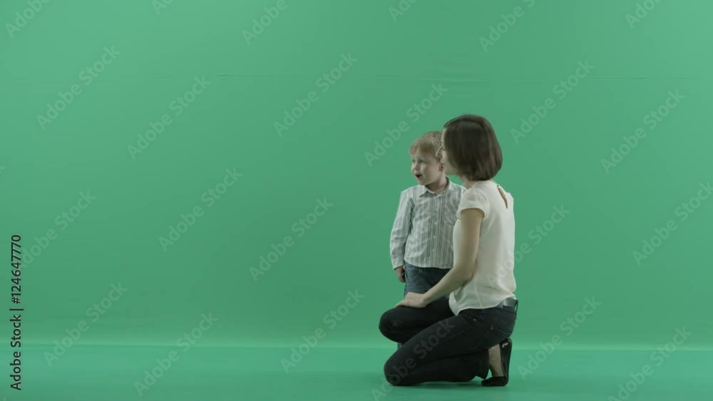 young woman is showing something to the child young woman is showing something to the child