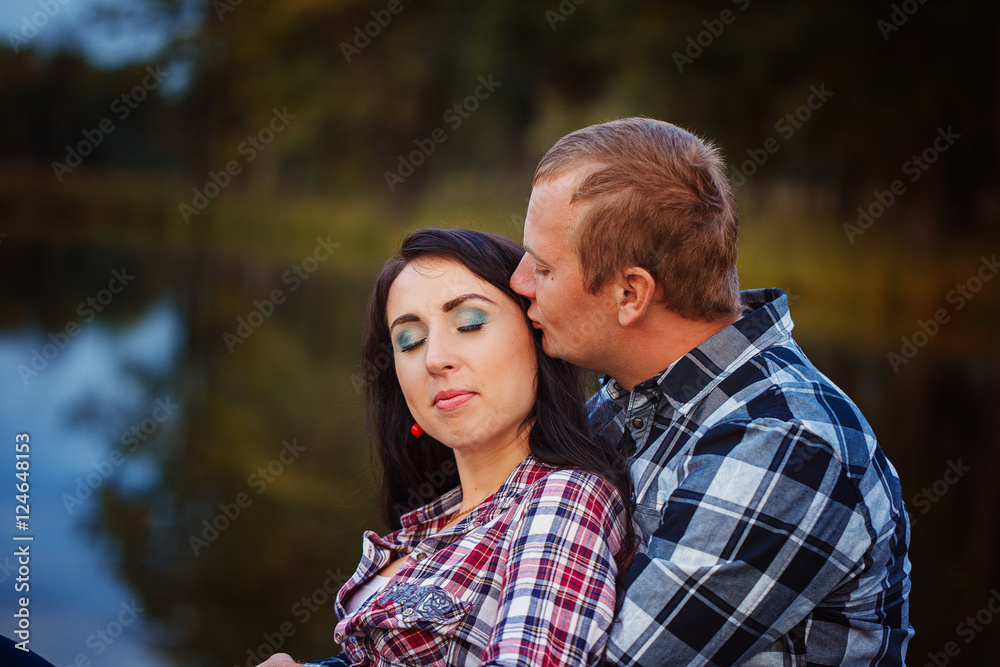 Passionate love in the autumn park. A young couple. Passionate love in the autumn park. A young couple.