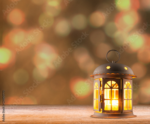 candle lamp lantern glowing on dark
