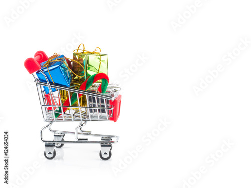 shopping cart with gift boxes isolated on white