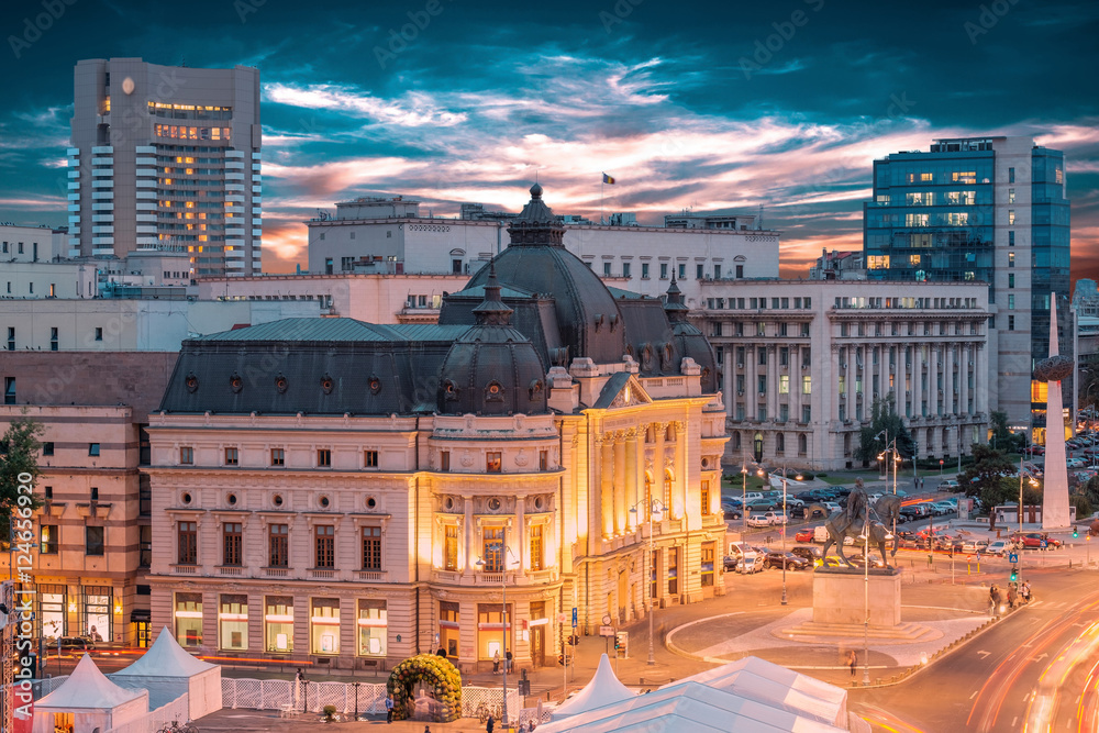 Long exposure aerial shot of the Revolution Square near Victoria Avenue in Bucharest, Romania. Traffic and historical buildings.Bucuresti