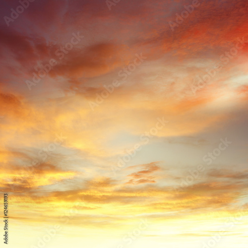 Warm summer sunrise orange clouds sunset sky background © Stillfx
