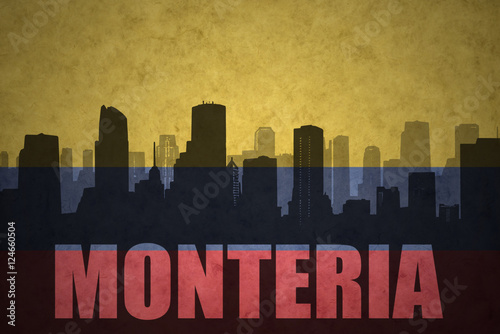 abstract silhouette of the city with text Monteria at the vintage colombian flag photo