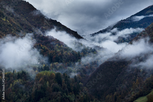 Clouds and autumnal colors in the Italian Alps