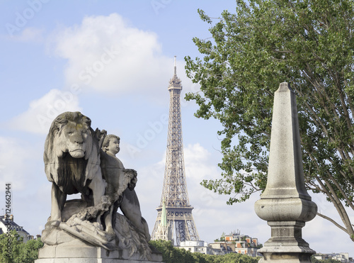 Statues of bridge of Alexandre III in Paris; the Eiffel Tower on the background.