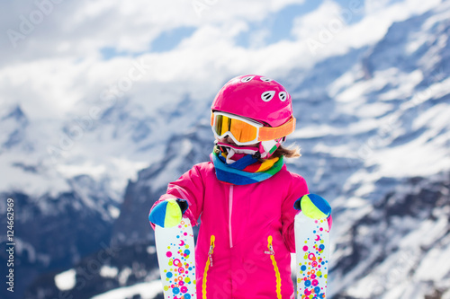 Little child skiing in the mountains