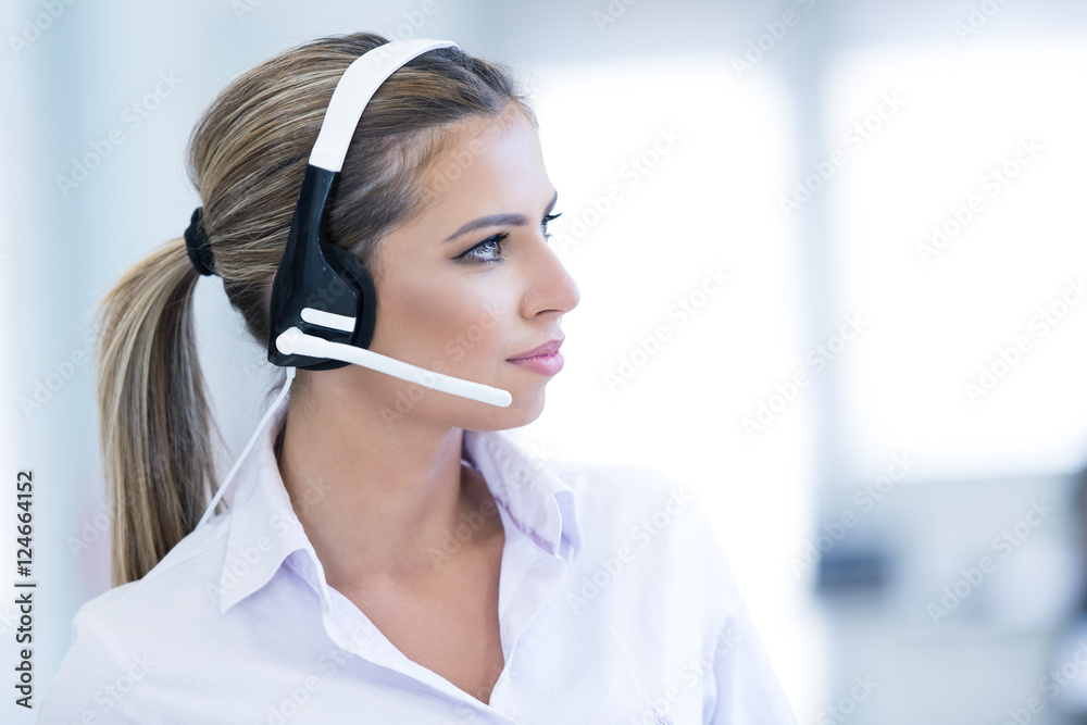 smiling female helpline operator with headphones smiling female helpline operator with headphones