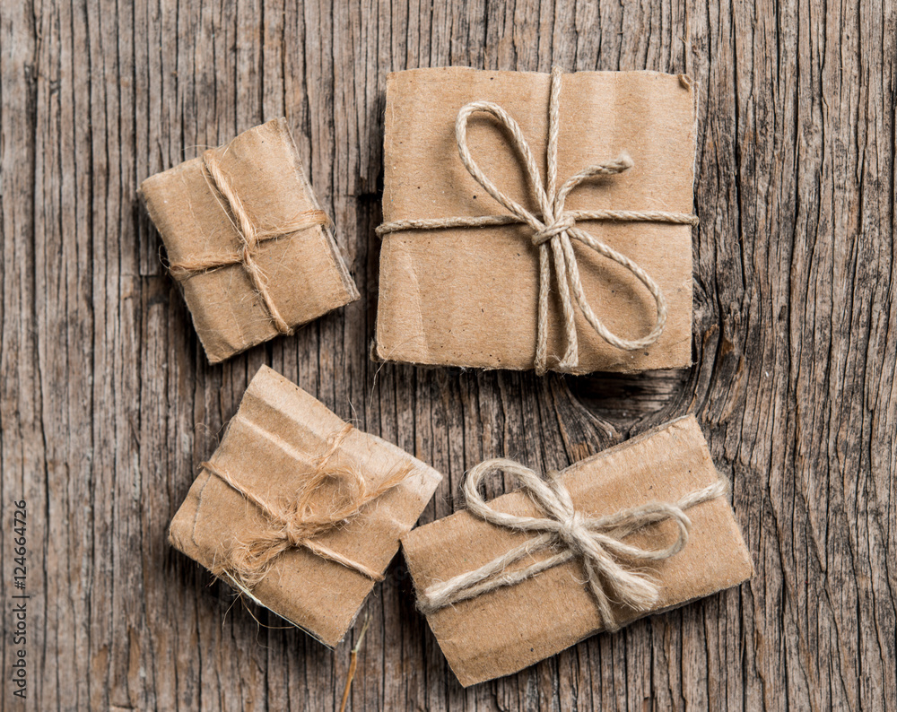 Handmade gift boxes on rustic wooden background Handmade gift boxes on rustic wooden background