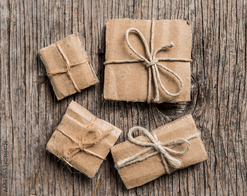 Handmade gift boxes on rustic wooden background