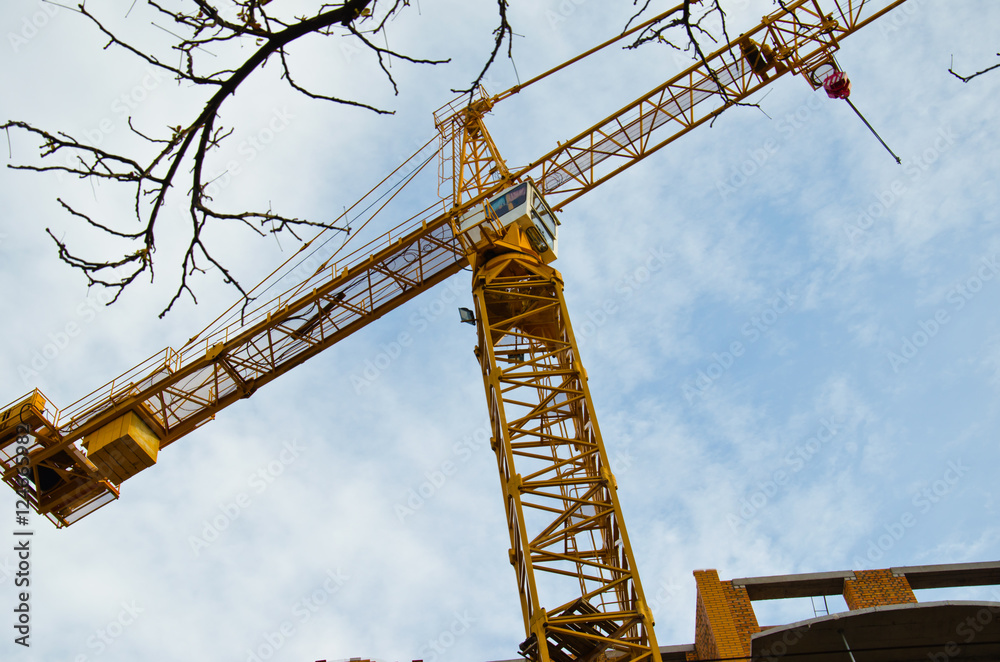High building crane at the construction site