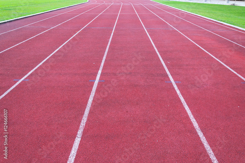 running track and green grass Direct athletics Running track at Sport Stadium