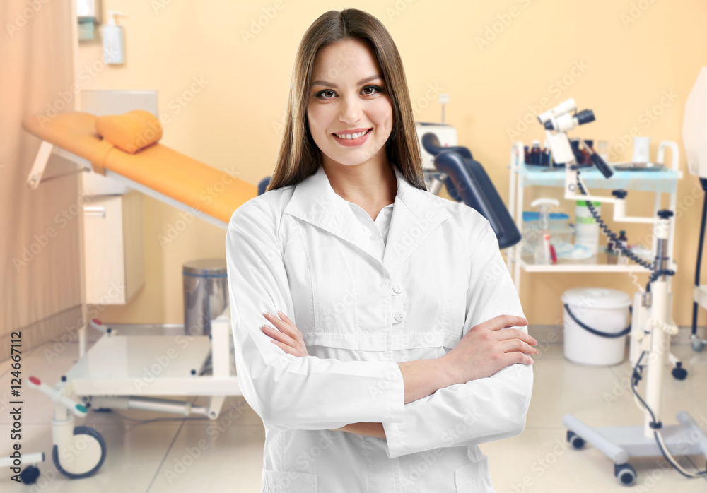 Professional female doctor on blurred consulting room background. Gynecology concept. Professional female doctor on blurred consulting room background. Gynecology concept.
