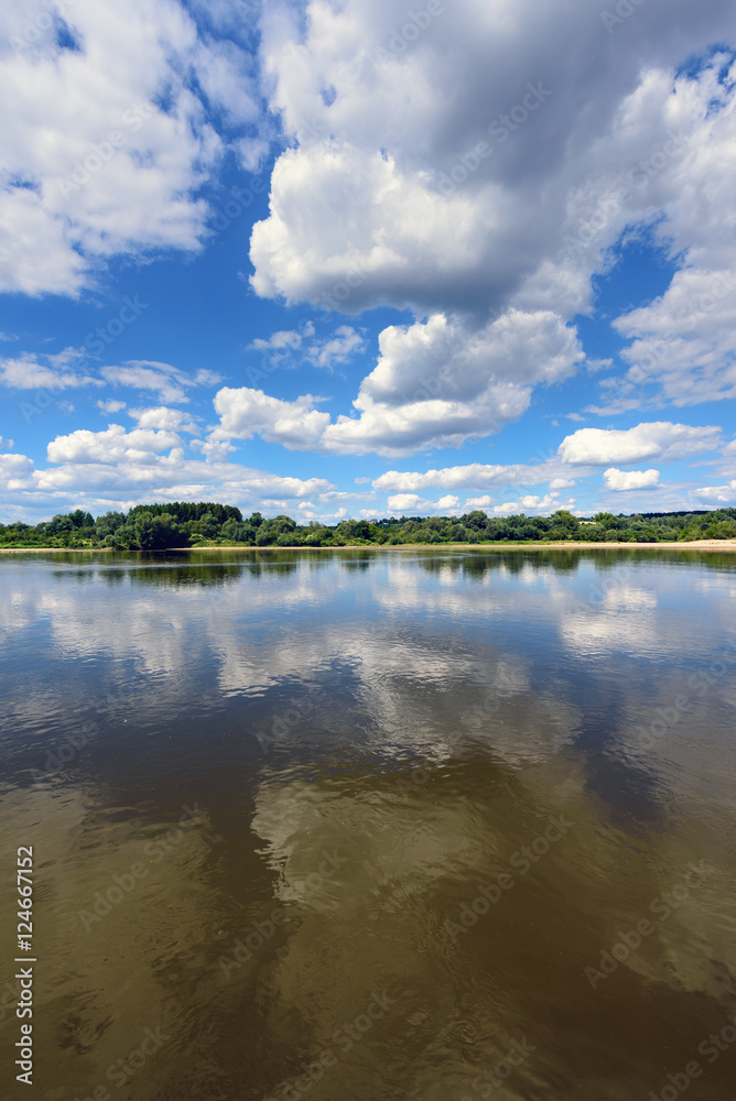 Amazing clouds over Vistula river in sunny day. Poland, Europe.