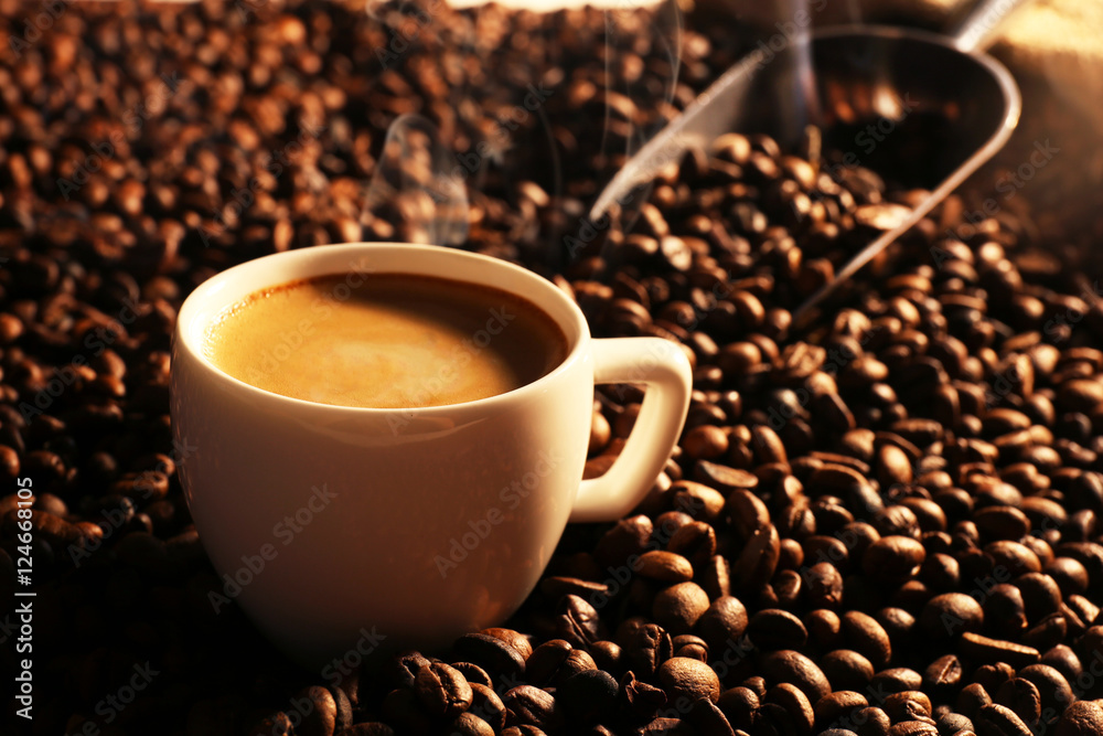 Roasted coffee beans with cup Roasted coffee beans with cup